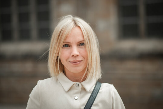 portrait of a blonde, beautiful woman 42 years old who looks younger than her age