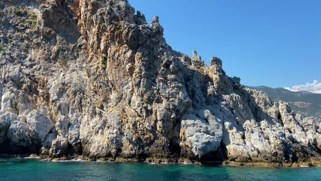 Mighty rocky mountains  in the mediterranean sea concept, fantastic mountain view from the sea, boat ride around the cliff in the sea, rocks against the blue sky 