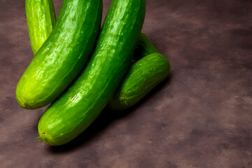 photo of green cucumbers, a fresh vegetable, recently harvested