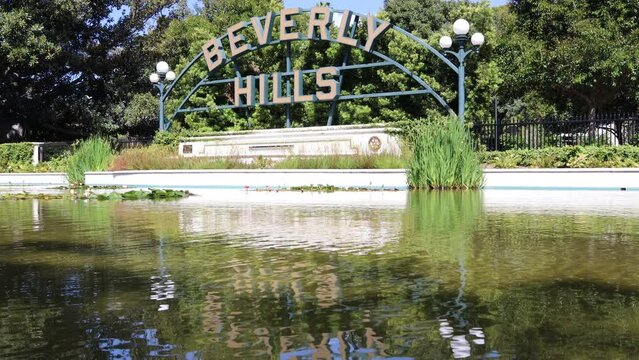 Beverly Gardens Park and the BEVERLY HILLS sign on Santa Monica Blvd. Beverly Hills, California