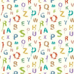 Fototapeta na wymiar Seamless pattern with alphabet letters in form of colored paint splashes and blots. Abstract vector background with latin letters. Suitable for wallpaper, wrapping paper or fabric