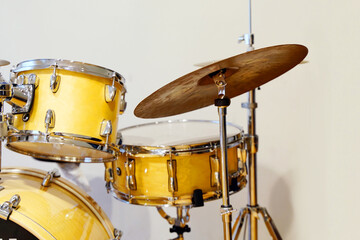 drum set in yellow on white background
