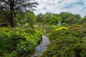 Japanese Garden at Montreal Botanical Garden. Strolling garden with stone lantern, stream, pond and native Canadian plants arranged with Japanese aesthetics and ideals. 