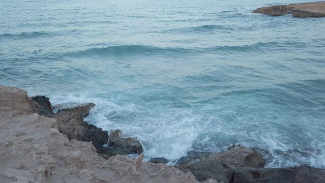 Waves hitting rocks on the shore in Spain 2