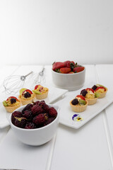 confectionery, sweet dessert, studio catering, appetizing and delicious cupcakes with pastry cream and fruits, restaurant