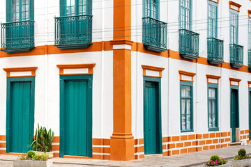 Traditional colonial architecture on Brazil. Beautiful colored buildings. Touristic destination. Travel aesthetic summer concept.