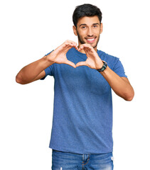 Young handsome man wearing casual clothes smiling in love showing heart symbol and shape with...