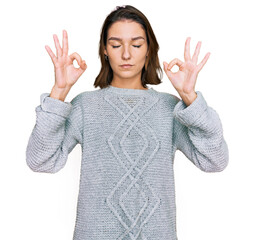 Young caucasian girl wearing casual clothes relax and smiling with eyes closed doing meditation gesture with fingers. yoga concept.