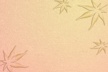 モミジの葉とシャンパンゴールドの背景秋イメージ