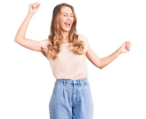 Fototapeta na wymiar Young beautiful caucasian woman with blond hair wearing casual clothes dancing happy and cheerful, smiling moving casual and confident listening to music