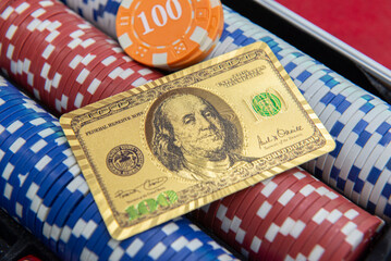 Gold playing cards and $100 bill format on poker chips