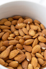 pile of almonds, texture details of dried grains, organic and natural food supplements