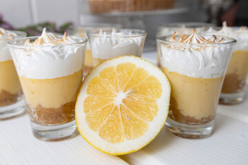 close up of drink with cream and cinnamon, decoration of appetizing desserts on a white background, sweets