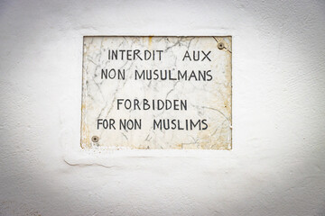 old wall street sign, forbidden for non muslims, kasbah of the udayas, rabat, morocco, north africa,
