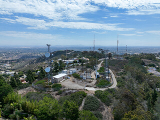 Aerial view of telecommunication tower with 5G cellular network antenna on the top of a valley in San Diego, South California