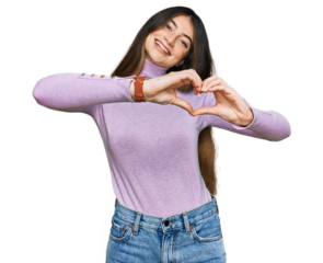 Young beautiful teen girl wearing turtleneck sweater smiling in love doing heart symbol shape with hands. romantic concept.