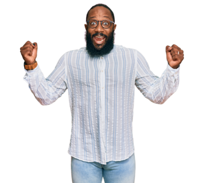 Young african american man wearing business shirt and glasses screaming proud, celebrating victory and success very excited with raised arms