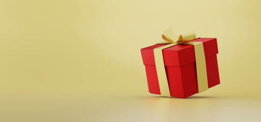 Red gift box on gold background. New Year and Christmas banner.