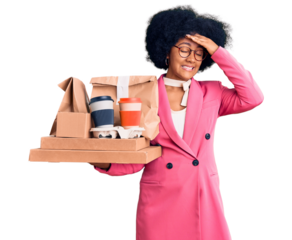Young african american girl wearing business clothes holding delivery food stressed and frustrated with hand on head, surprised and angry face