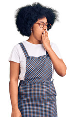 Young african american girl wearing casual clothes bored yawning tired covering mouth with hand. restless and sleepiness.