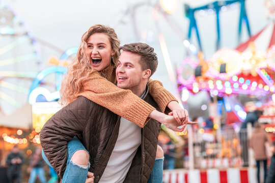 Happy Couple Having Fun At Amusement Park In London