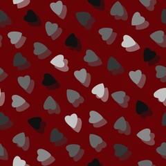 Simple colorful hearts seamless pattern chaotic on red background made of tiny heart silhouettes of overlapping layering effect.For Valentines,mothers day,Easter,wedding,gift wrapping paper,textiles