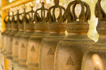Blurred image of hanging bells on the background.