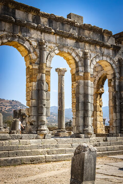 roman forum ruins, arches, volubilis, morocco, north africa