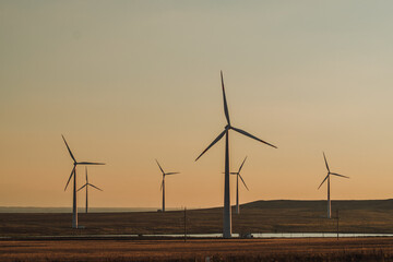 wind turbines at sunset