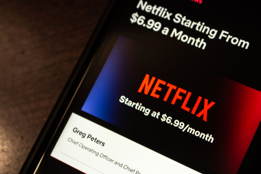 Vancouver, CANADA - Oct 17 2022 : Netflix’s new subscription plan “Basic with Ads” announcement page on its website on an iPhone. Basic with Ads will cost $6.99 a month in the US