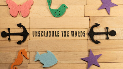 Unscramble the words written on wooden surface. Economy and markets. - obrazy, fototapety, plakaty