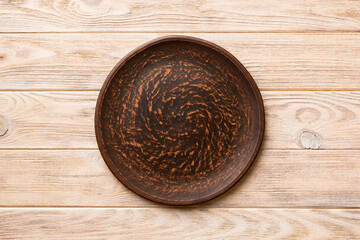 Top view of empty plate on wooden background. Empty space for your design