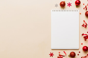 Christmas blank greeting card mock-up scene. Creative layout made of Christmas tree branches and paper card note. Flat lay. Nature New Year concept