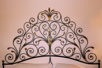 Metal decor over bed
