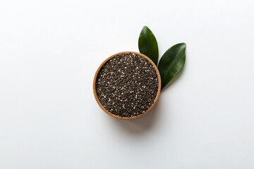 Chia seeds in bowl on colored background. Healthy Salvia hispanica in small bowl. Healthy superfood