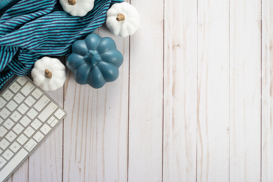 Pumpkin, Keyboard, And Blue Scarf Blanket Top Down Flatlay Concept, For Bloggers, Desk, Work From Home, And Cozy Fall Projects. Blue Color