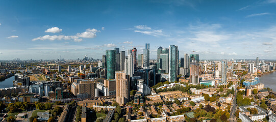 Fototapeta na wymiar Aerial panoramic skyline view of Canary Wharf, the worlds leading financial district in London, UK. Business center of London.