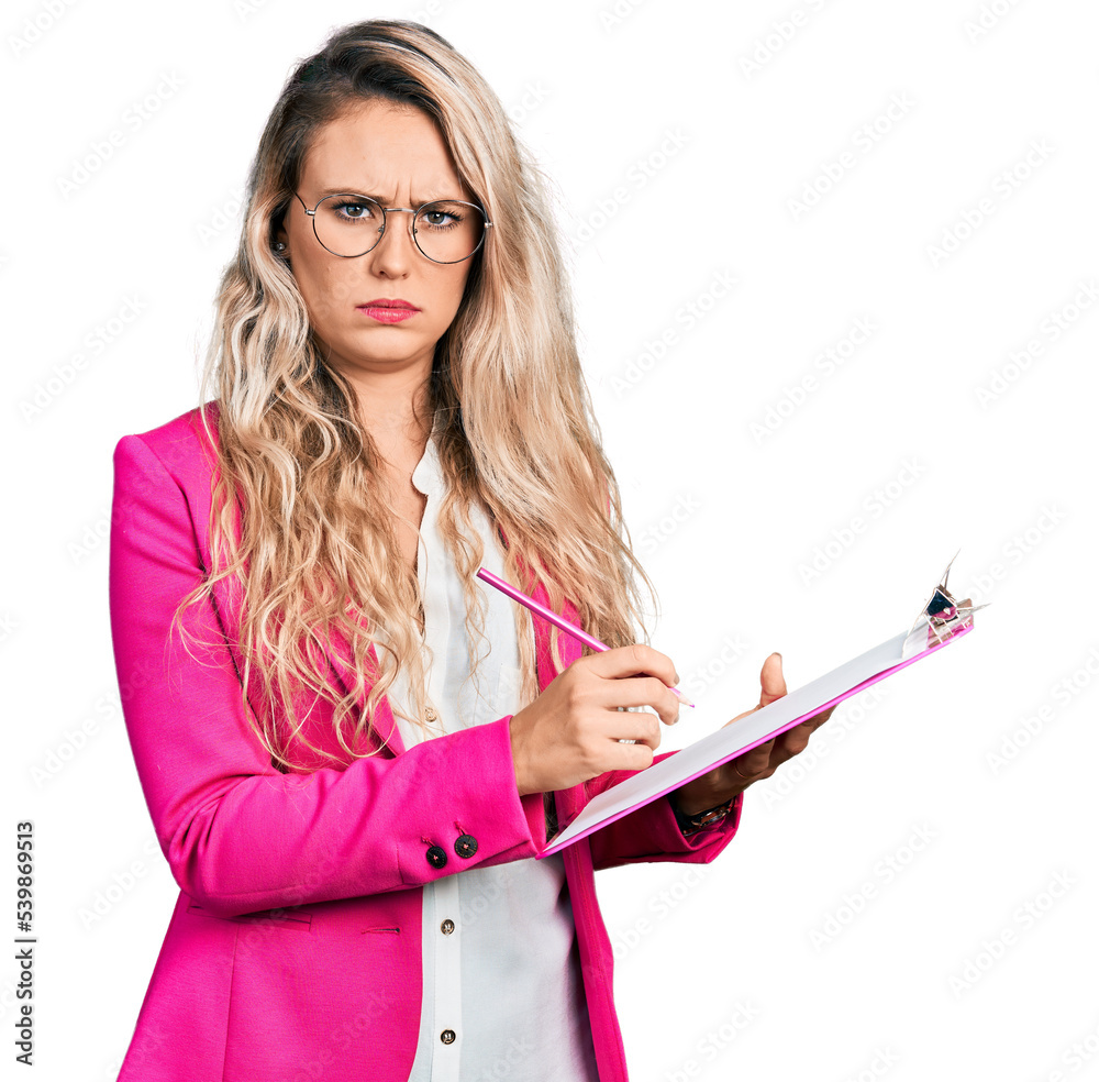 Sticker young blonde woman writing on clipboard skeptic and nervous, frowning upset because of problem. nega