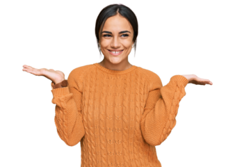 Young brunette woman wearing casual winter sweater clueless and confused expression with arms and hands raised. doubt concept.