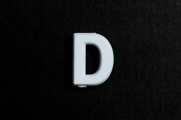 Letter D on a black background