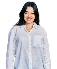 Beautiful hispanic woman wearing casual white shirt with a happy and cool smile on face. lucky person.