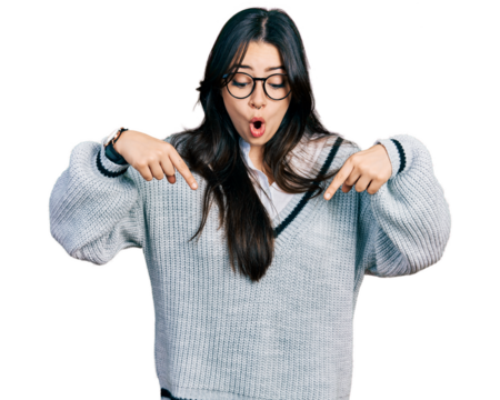 Beautiful hispanic woman wearing casual sweater and glasses pointing down with fingers showing advertisement, surprised face and open mouth