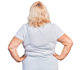 Middle age blonde woman wearing casual white t shirt standing backwards looking away with arms on body