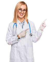 Beautiful caucasian woman wearing doctor uniform and stethoscope smiling and looking at the camera pointing with two hands and fingers to the side.