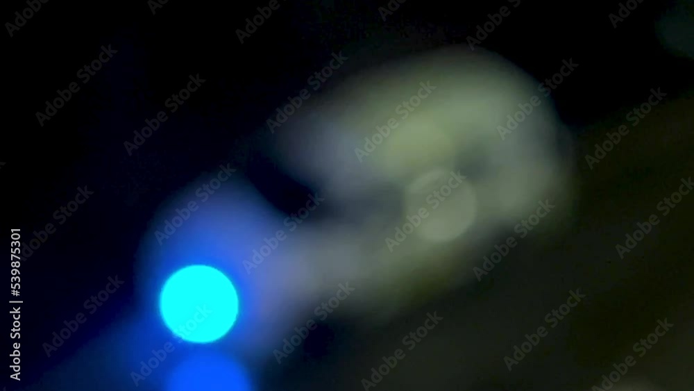 Sticker Blurred shot of a police car with blinking blue lights