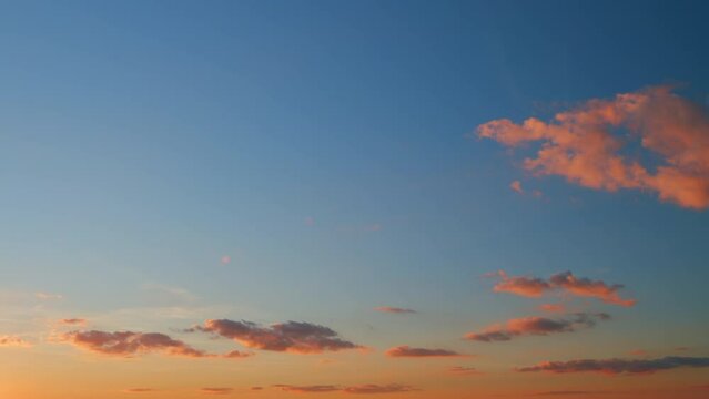 Beautiful colorful panorama of summer sunset blue sky with different shades. Timelapse.