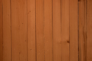 Fototapeta premium Thin wooden slats patterned background stained in a golden oak color