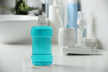 Bottle of mouthwash on white countertop in bathroom