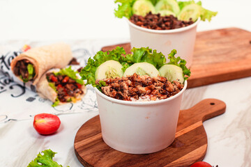 rice ball with kebab meat and fresh vegetables