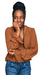 Young african american woman wearing casual clothes looking stressed and nervous with hands on mouth biting nails. anxiety problem.